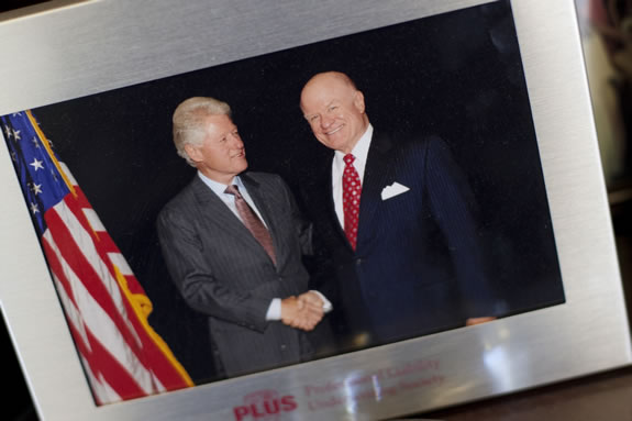Patrick Kelly keeps a photo of a meeting with former President Bill Clinton.<br /><em>Photo by Stephanie Diani</em>