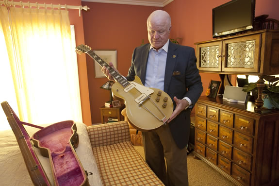 Patrick Kelly shows off his collection of guitars.<br /><em>Photo by Stephanie Diani</em>