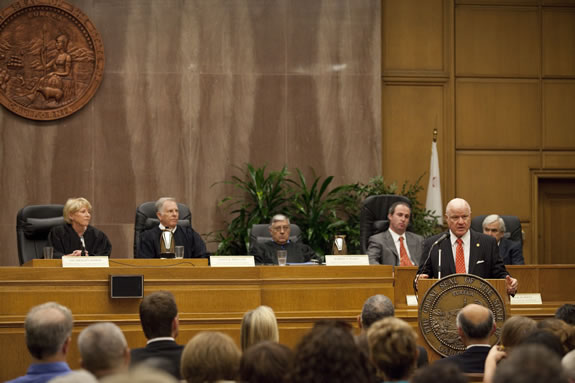 Patrick Kelly addresses the audience at a swearing-in ceremony for new judges.<br /><em>Photo by Stephanie Diani</em>
