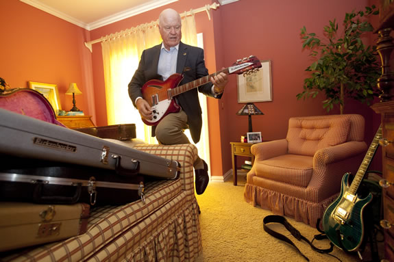 Patrick Kelly plays a few chords on a vintage Rickenbacker electric guitar.<br /><em>Photo by Stephanie Diani</em>