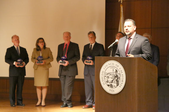 State Bar President Luis J. Rodriguez accepts the Stanley Mosk Defender of Justice Award.