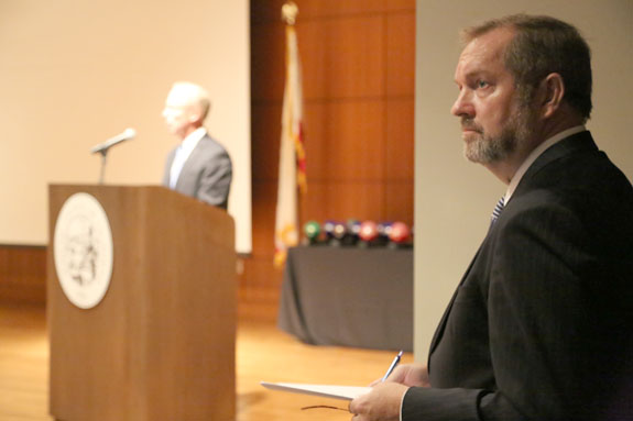 Shasta County Superior Court Judge Stephen H. Baker, the master of ceremonies, waits in the wings as Judicial Council Administrative Director Steven Jahr welcomes more than 100 people to the awards ceremony at the Judicial Council.