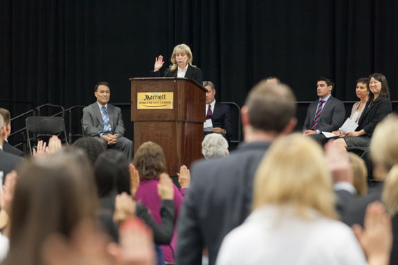 All raise their hands to take the oath from 1st District Court of Appeal Clerk/Administrator Diana Herbert to become new members of the bar.   <em>Photo by S. Todd Rogers</em>